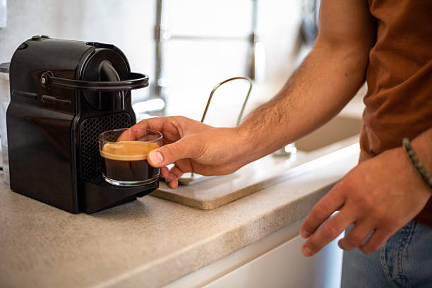 Man making espresso coffee at home