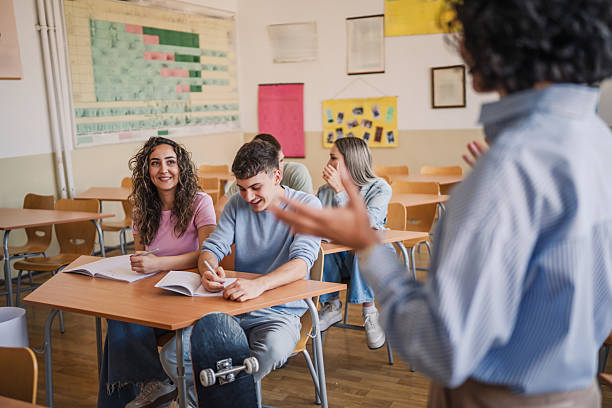 istock Back view of professor talk about lecture to high school students 2217195124