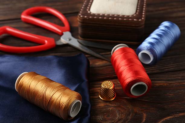 istock Different sewing supplies on wooden table, closeup 2217198539