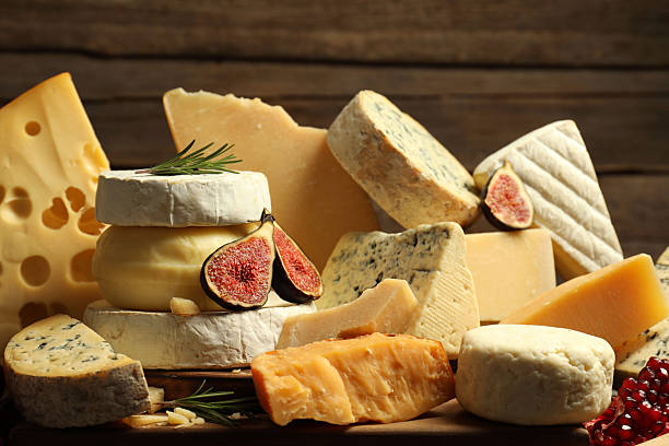 istock Different types of cheese, rosemary, figs and pomegranate on table 2217198641
