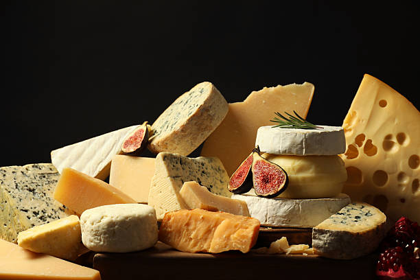 istock Different types of cheese, rosemary, figs and pomegranate on table 2217198651