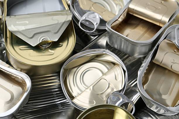 Many crumpled tin cans as background, closeup