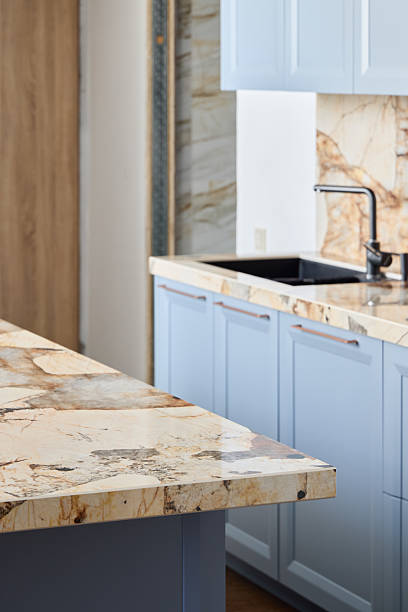 istock An Elegant Kitchen Design Featuring Beautiful Marble Countertops and Light Blue Cabinets 2217203064