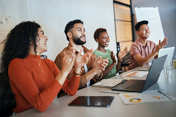 istock Enthusiastic Team Applauding Success 2217205519