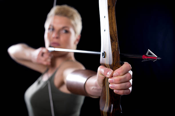 Young woman bow hunting with crossbow