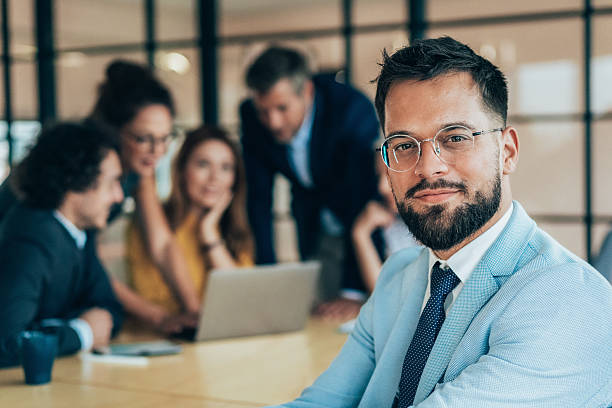 istock Confident businessman and his team 2217211431