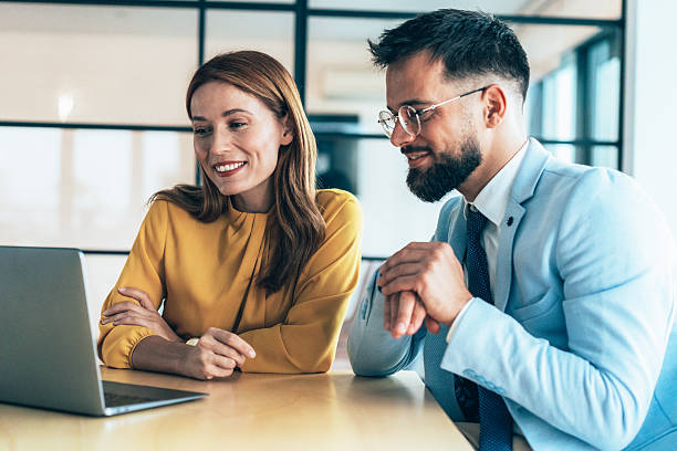 istock Two business coworkers talking 2217211434