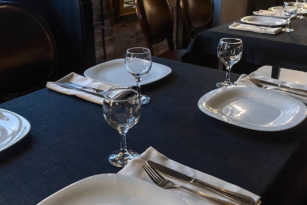 istock Elegant table setting for a gourmet dinner celebration with fine glassware and stylish cutlery in a modern restaurant ambiance 2217215355