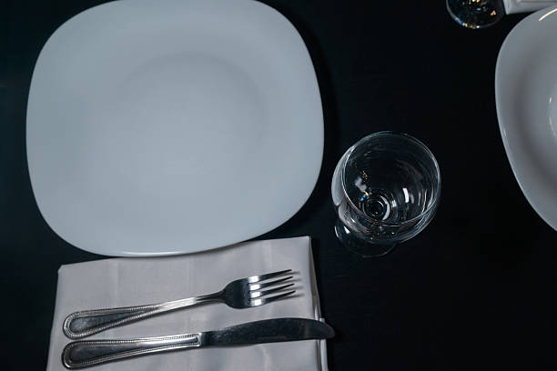 istock Elegant table setting for a gourmet dinner celebration with fine glassware and stylish cutlery in a modern restaurant ambiance 2217215358