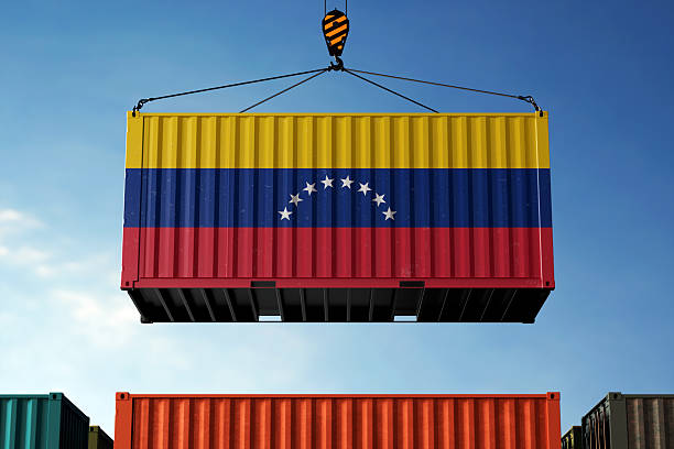 istock Venezuela trade cargo container hanging against clouds background 2217219329