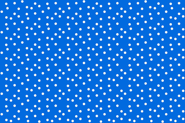 istock Classic and clean This vibrant blue backdrop adorned with white polka dots offers a retro feel. Perfect for designs, textiles, or fun, playful layouts. Versatile for diverse creative projects. 2217224950