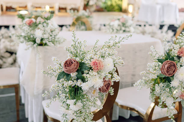 istock Elegant Wedding Ceremony Decor  Gold Chairs White Table Pink Flowers 2217225443