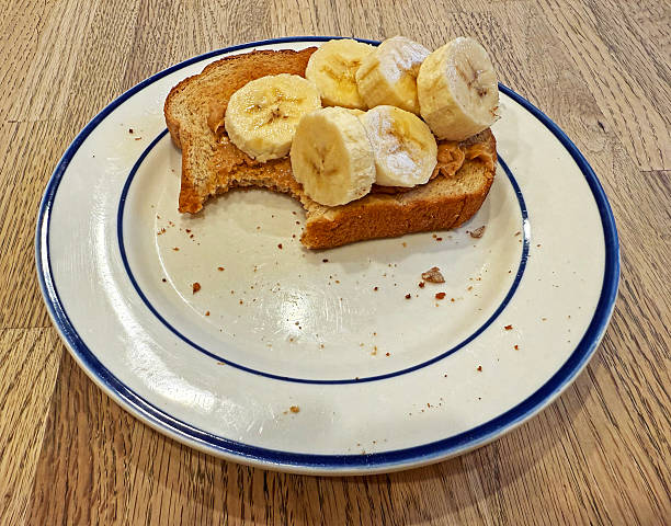 istock Toast with Peanut Butter and Banana with Bite Take Out 2217226791