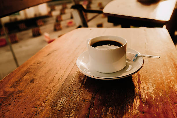 istock White Coffee Mug On Wooden Table In Warm Light 2217227234