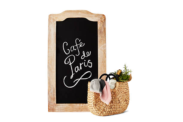 istock Rustic chalkboard sign with woven basket and wine bottle 2217228287