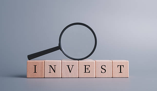 istock Magnifying glass for data analysis for investment, reduce risk before investing 2217228760