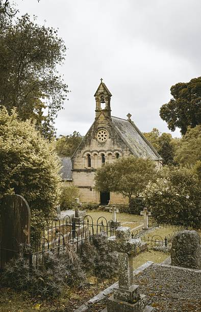 istock Historic chapel and graveyard in lush landscape. 2217228896