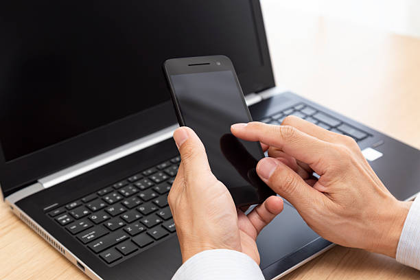 istock The hands of a man using a smartphone. 2217230450