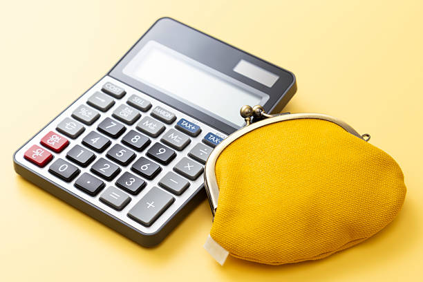 istock Calculator and wallet on a yellow background. 2217230507