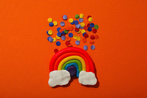 istock LGBT parade concept, symbols on orange background. 2217230525