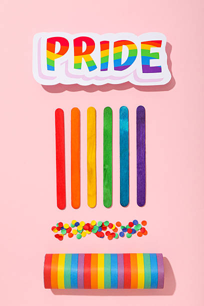 istock LGBT parade concept, holiday symbols on pink background. 2217230794