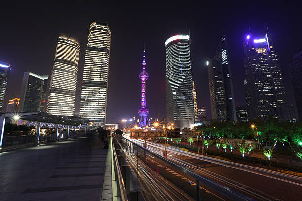 Shanghai, China - May 29, 2024: The skyline of Shanghai comes alive at night, showcasing illuminated skyscrapers and vibrant lights, reflecting the city's modernity and energy.