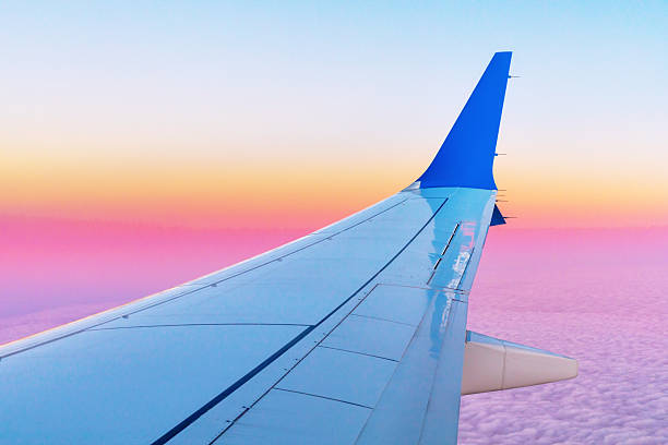 istock Beautiful sunrise, sky on the top view, airplane flying view from inside window. flying and traveling. 2217246772