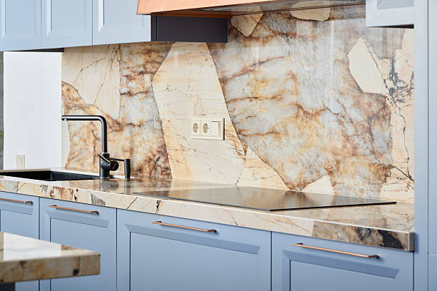 An Elegant and Stylish Kitchen Featuring a Stunning Marble Backsplash and Modern Design Elements