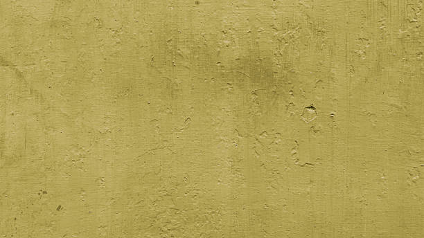 istock full frame of earth yellow painted wall textre background, blank background for copy space or web banner 2217248163