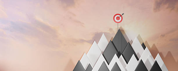 istock Goal. Success. Target. Leadership concept. A visually striking representation of achieving goals, featuring a target on a mountain peak symbolizing success and aspiration. 2217254129
