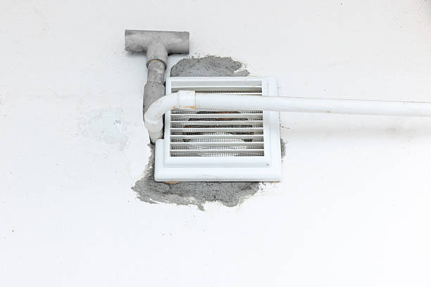 istock Drill a Hole Through Concrete Wall For Bathroom Air Duct. 2217254388