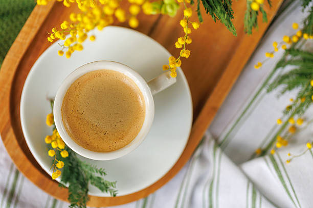 istock A cozy spring coffee break with mimosa flowers 2217254693