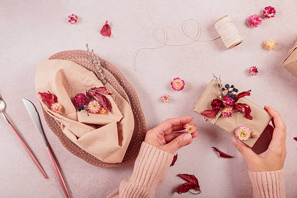istock Process of decorating festive autumn table setting with dried flowers 2217257178