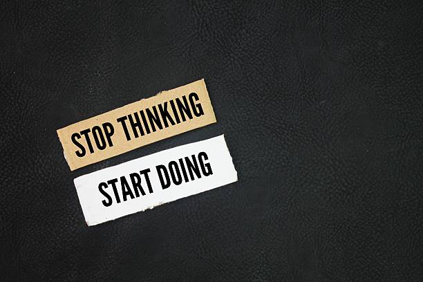 istock Paper with inspirational and motivational things or quotes stop thinking, start doing concept for beginners or just starting out. 2217261749