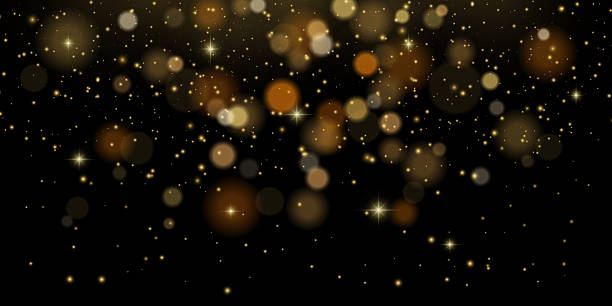 istock Golden bokeh glitter with firework sparkles and confetti rain. Festive flare and luxury magic light on dark background. Perfect for holiday, New Year or Christmas celebration. 2217265034