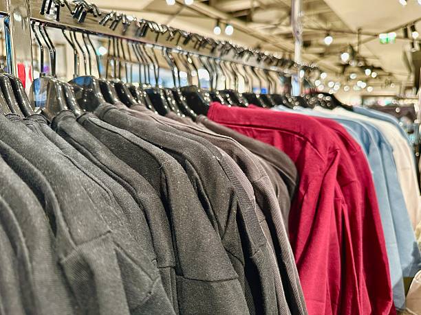 istock new clothes in the store on hangers 2217265912