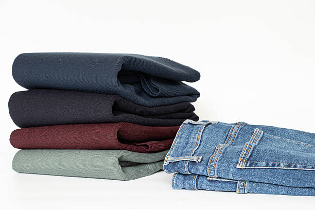 istock Folded men's sweaters and jeans on a white background, a set of clothes for a wardrobe, store 2217276321