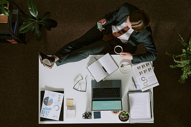 istock Businessperson Reviewing Documents in Office Setting 2217277145