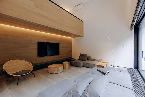 istock A cozy living room with a comfortable couch and a wall TV 2217278511
