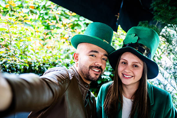 istock Couple taking a selfie or filming on saint patrick's day on a bar 2217278919