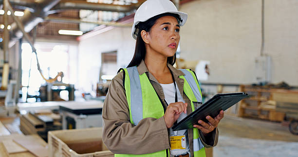 istock Planning, woman and carpenter with technology for construction, insight and vision for development. Tablet, inspection and engineer in warehouse for woodwork, manufacturing and thinking in industry 2217280237