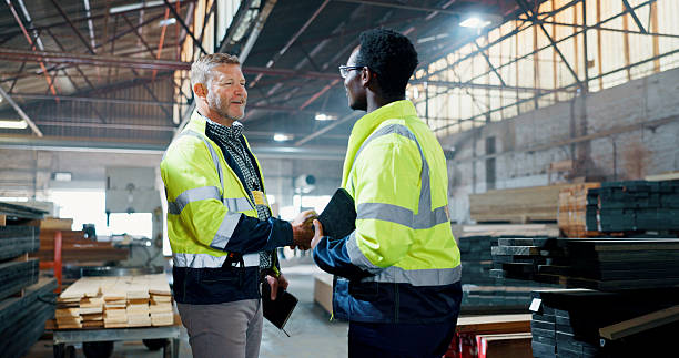 istock Men, engineer and handshake for carpentry at workshop for partnership, agreement and construction deal. People, shaking hands and welcome for b2b, manufacturing negotiation and onboarding opportunity 2217280311