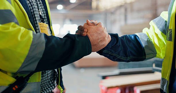 istock People, engineer and handshake for carpentry at warehouse for partnership, agreement and construction deal. Men, shaking hands and welcome of b2b, manufacturing negotiation and onboarding opportunity 2217280312