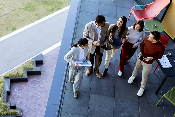 istock Team brainstorming and collaboration on a terrace during a sunny afternoon in a modern setting 2217281141