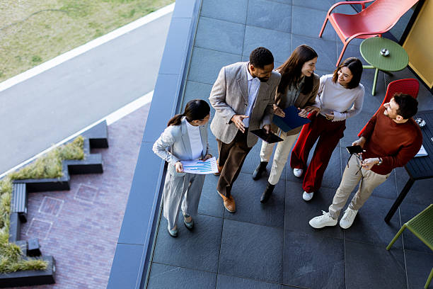istock Team brainstorming and collaboration on a terrace during a sunny afternoon in a modern setting 2217281151
