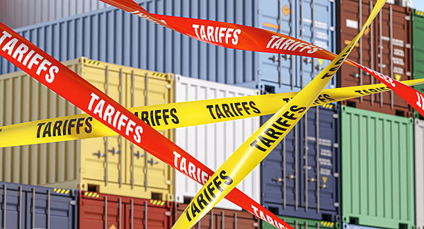 istock Tariffs barrier tapes blocking international trade and shipping containers 2217282596