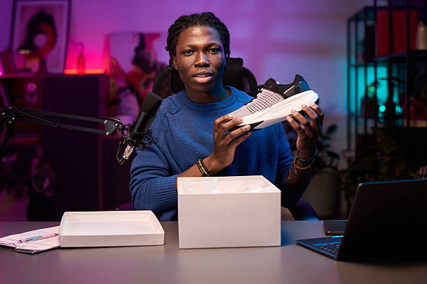 Portrait of Man Displaying New Sneaker from Box