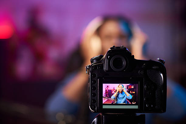 istock Recording Vlog with Camera and Vibrant Background 2217285476