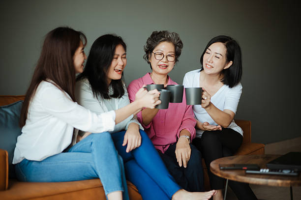 istock Three Daughters and Their Senior Mom Sharing a Joyful Moment. 2217286365