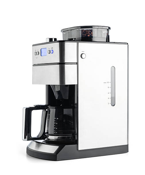 istock Modern drip coffee maker with built-in grinder, isolated on white background. Glass carafe, digital display, and stainless steel design. File contains a path to isolation. 2217287256